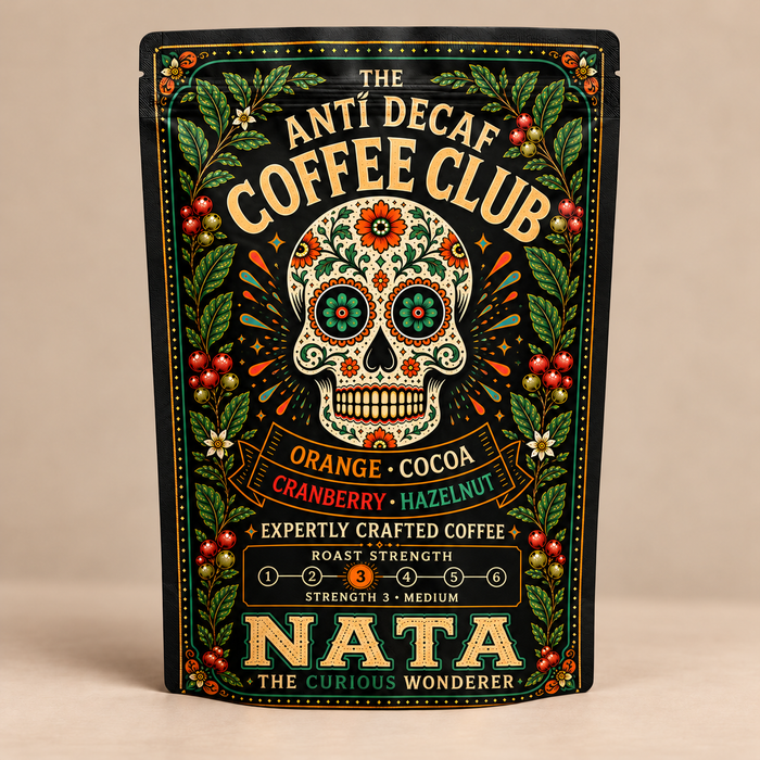 Nata "The Curious Wonderer" blend — green botanical bag, photographed against a warm beige studio background
